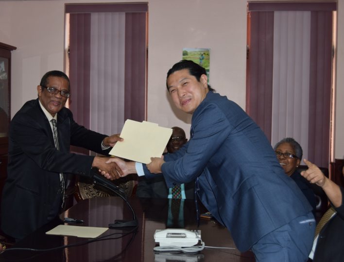 Photo 1: Osmond Petty (left), Permanent Secretary in the Ministry of National Security, exchanges signed Agreement with Miles Chen (right) Representative of VIVOTEK.