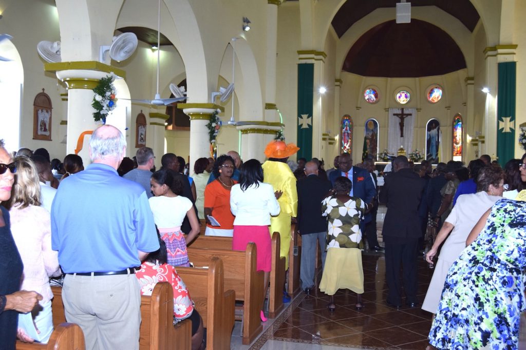 PM Harris greets congregation members