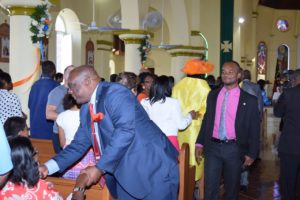 PM Harris greets congregation members