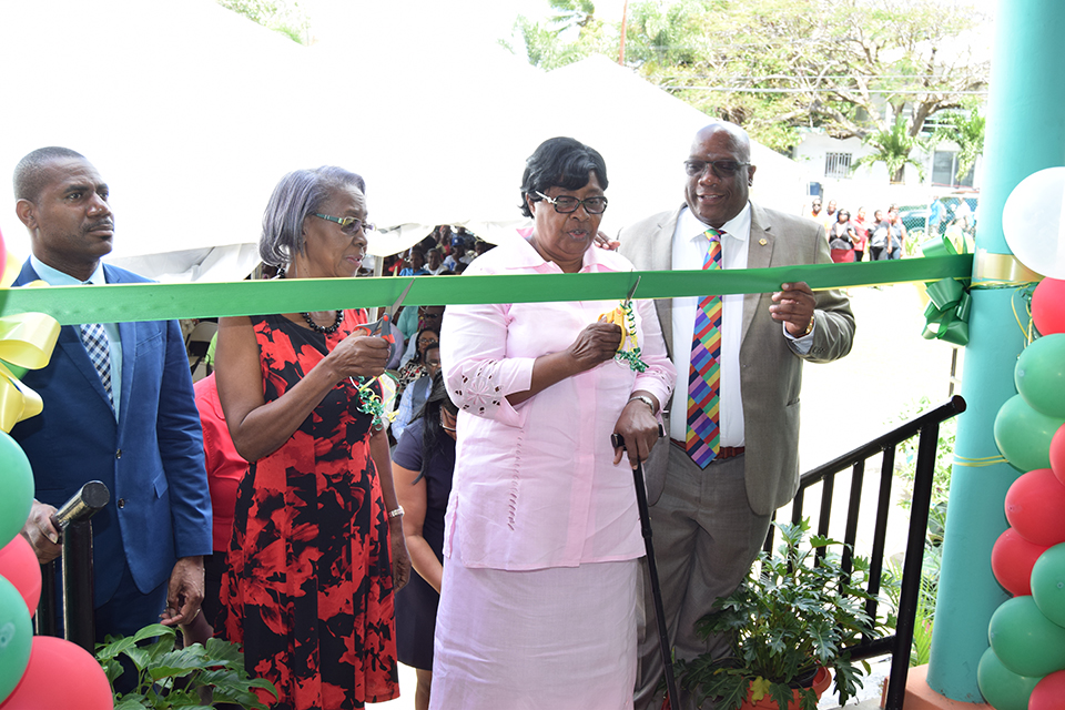 Mrs. Walters and Mrs. James cut ribbon to new preschool