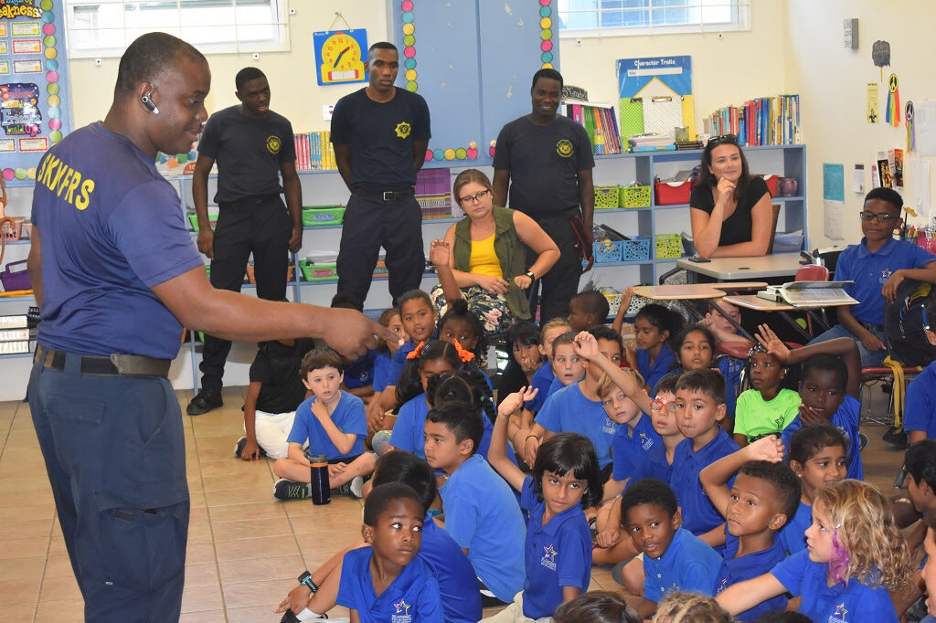 FIRE OFFICERS TEACH CHILDREN ABOUT FIRE SAFETY